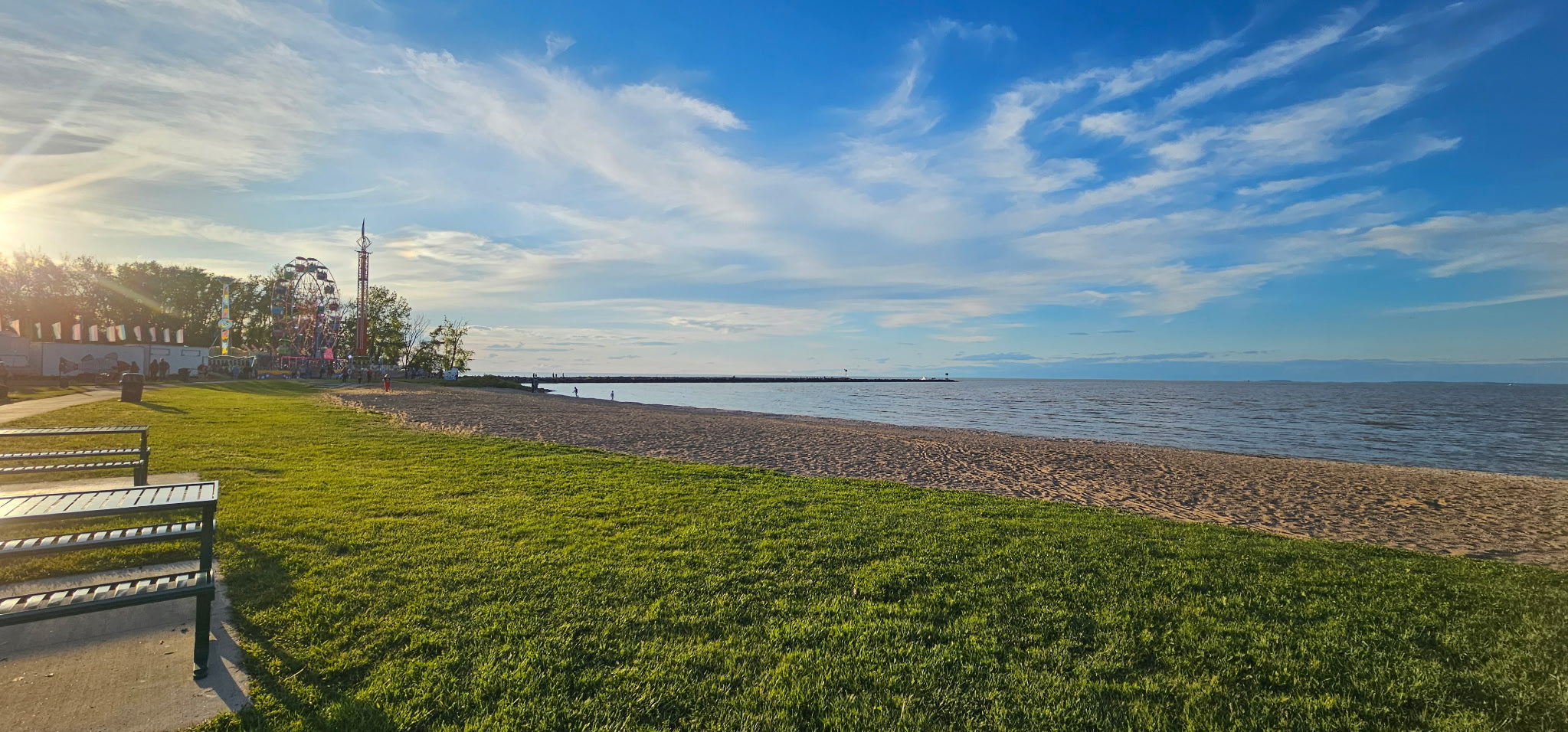 View of Waterworks Park in Port Clinton Ohio Memorial Weekend 2025 just before dusk  overlooking the lake with the festival rides in the distance